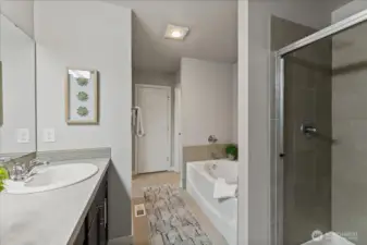 Relax and unwind in the luxurious soaking tub with a separate walk-in shower for added convenience.