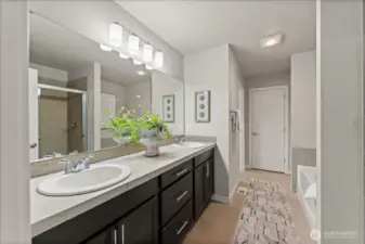 Thoughtfully designed primary bath includes a private commode room for enhanced comfort and privacy.