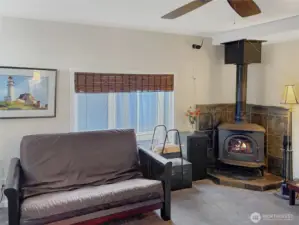 Living room with free standing wood stove.