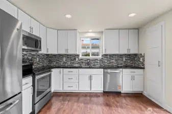Beautiful remodeled kitchen with custom backsplash