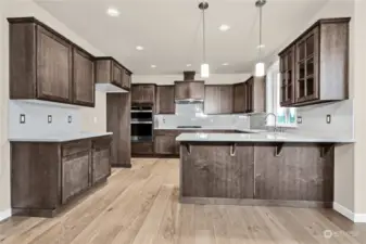 Similar home, not actual. Lots of room in this kitchen and full extension guides and soft close drawers throughout.