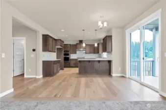 Similar home, not actual. Nook area between living room and kitchen for an additional eating space.