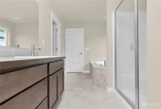 Similar home, not actual. Primary bed bathroom.