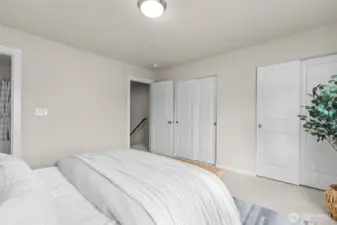 Spacious primary bedroom with peaceful natural light.