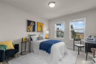 Well-sized second bedroom with plush carpet and make sure to catch the tranquil view of the mountains.
