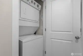 Washer and dryer easily accessible from both bedrooms.