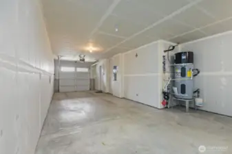 Attached two-car tandem garage with ample storage space and access to the interior and back patio