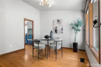 Dining room with newer chandelier.