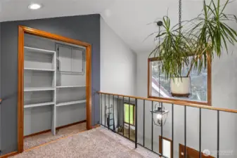 Upstairs landing with access to tons of attic storage.
