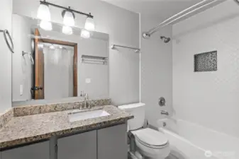 Upstairs full bathroom, fully updated with floor to ceiling tile