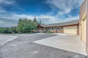 Parking area and view of front of home looking West