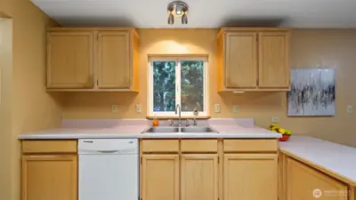 Tidy kitchen with skylights