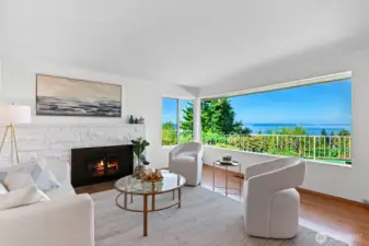 As you enter the living room you are immediately drawn to the view. A western wall of windows takes in Puget Sound, Vashon and Blake Islands and the Olympic Mountains.
