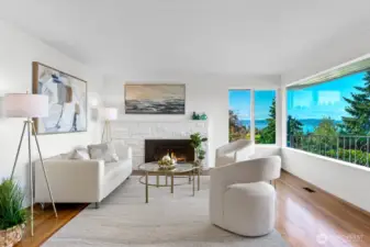 Hardwood floors, a wood burning fireplace and extraordinary views enhance this room.