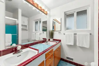 Colorful vintage tile bath serves the main level.