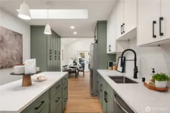 Just beyond the kitchen is even more storge with the bank of pantry cabinets to the left.