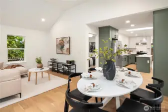 The kitchen flows into the great room with soaring vaulted ceilings.