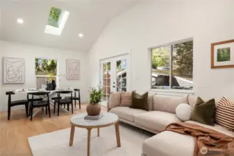 Looking back across the living room the french doors lead to the new deck and backyard as well as the garage.