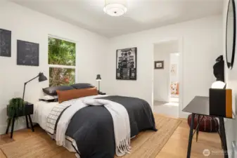 The first of three bedrooms this one can easily handle a king sized bed and features a private en suite shared by the two mainfloor bedrooms.