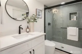The basement bedroom also features extensive tile work and designer finishes.