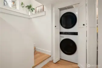 A brand new full-size stack washer and dryer are located downstairs.