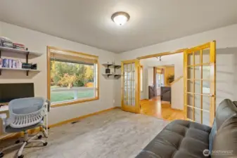 Flexible main floor space for office, den or hobbyist.