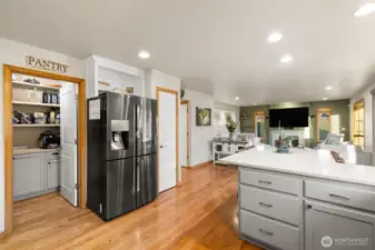 Kitchen and great room open to outdoor living space.