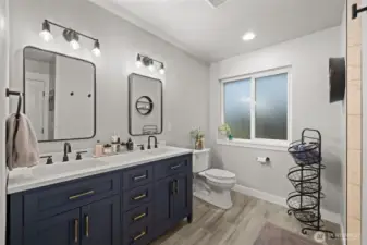 Newly updated primary bath with radient heated flooring.