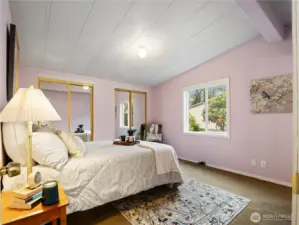 The primary bedroom with its own en suite is located at the opposite end of the home from the other two bedrooms.