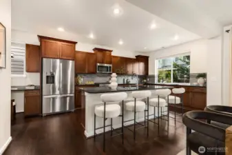 Oversized center island with sink, additional storage and additional seating