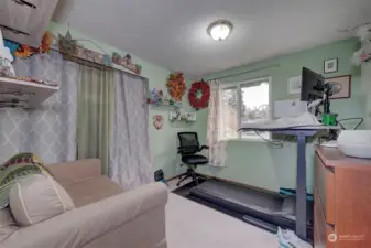 Currently used as a work at home office, this is also a spacious bedroom with generous closet space and bright window.