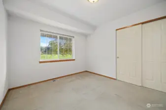 The 3rd bedroom also looks out to the golf course and is across from the full bath.