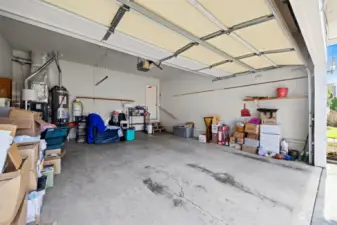 The 2 vehicle garage is spacious and has the new furnace and hot water tank in it.