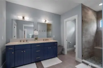 Primary Suite bathroom. Glass shower and double sink!