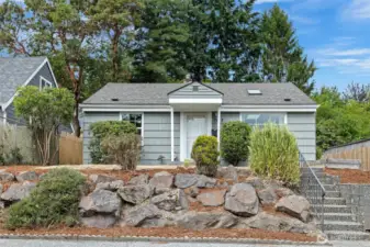 Perched up from the street for privacy, this charming home has plenty of garden space to play, cultivate or entertain.