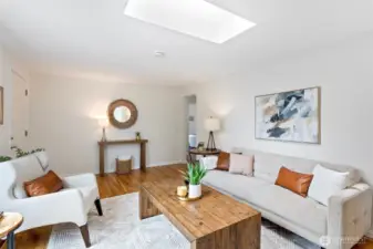 Freshly painted, the living room has oak flooring and a large footprint to accommodate various designs.