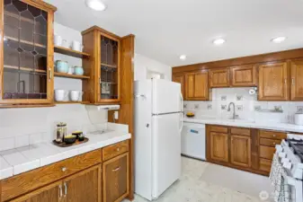 Beautiful glass covered cabinets in an extra serving area for overflow or display your favorites.