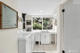 Laundry room downstairs -- has refrigerator and large sink.   Add a stove and the downstairs could be a full MIL.