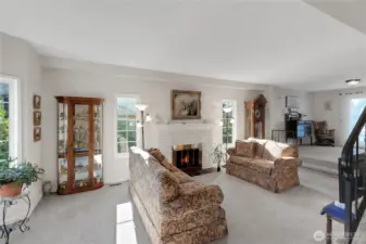 A Sunken Formal Living Room with a wood burning FirePlace