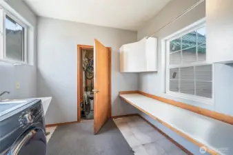 laundry/mudroom between attached garage and kitchen
