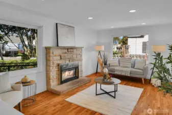 Light filled living room with gas fireplace