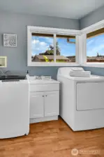 Utility room with half bathroom