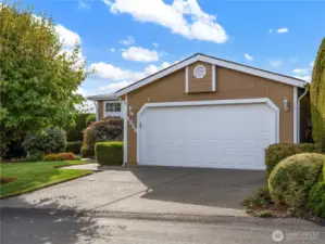 Lot's of space to park and the spacious two-car garage holds not only your two cars but your tools and all.
