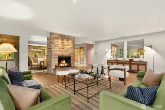 Gorgeous hardwood floors + a prominent brick fireplace, anchors the space.