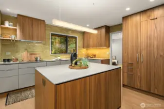 The kitchen stuns... with Henry Built custom cabinets completed with Dekton countertops.