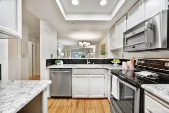 Nicely updated kitchen with granite counters and backsplash.