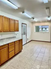 Utility room with office/craft space and access to garage