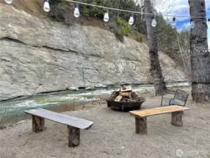 Firepit with 2 RV electrical hookups along the river.