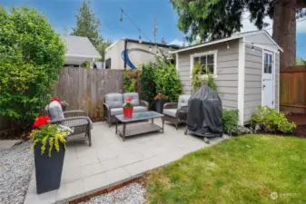 Park-like and peaceful fully fenced backyard has deck with gas hook up for bbq, patio seating area, garden shed, beautiful garden space and updated/finished detached garage off the alley.