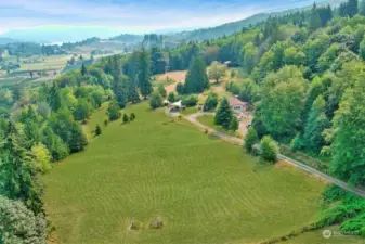 Nice view of pasture with home and buildings in the distant